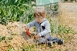 Kid playing. Beautiful child enjoying nature outdoors.