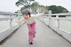 Kid playing on the bridge