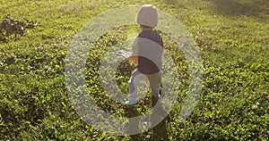 Kid playing with car on remote control