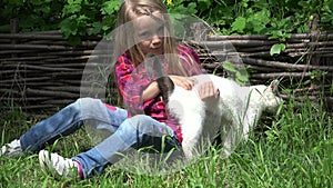 Kid Playing with Cat, Child Petting her Pet, Happy Smiling Girl with Kitten in Grass Garden