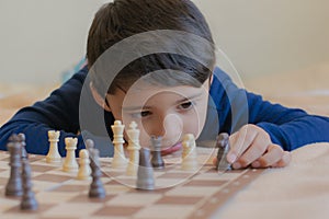 Kid playing chess smart fun