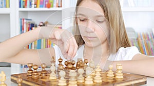 Kid Playing Chess in Library, Child Practicing, Learning, Teenager Blonde Girl Studying Brain Game