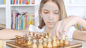 Kid Playing Chess in Library, Child Practicing, Learning, Teenager Girl Studying