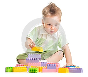 Kid playing colorful building blocks
