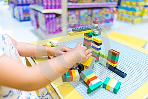 Future architect kid playing with toy bricks