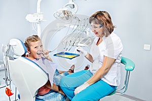 Kid playing with dental drill