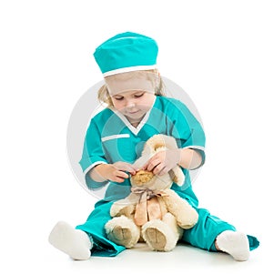 Kid playing doctor and curing toy