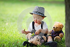 Kid playing with doll in the park