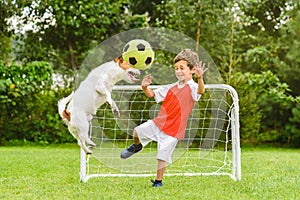 Kid playing football soccer as goalie afraid of ball flying after header shot