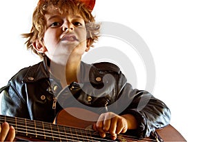 Kid playing guitar