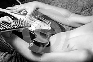 Kid playing guitar