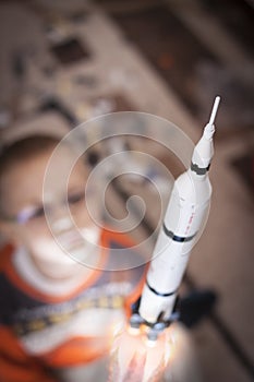 Kid playing with imaginary real rocket