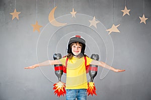 Kid playing with jet pack at home