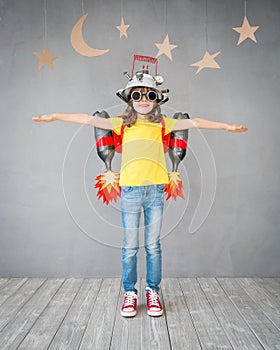 Kid playing with jet pack at home