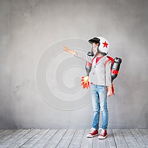 Kid playing with jet pack at home