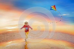 Kid playing with kite on beach