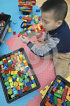 Kid playing lego