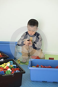 Kid playing lego