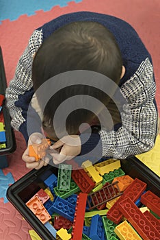 Kid playing lego