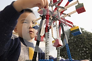 Kid playing lego block