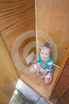Kid playing in old wardrobe