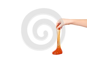 kid playing orange slime with hand, transparent toy