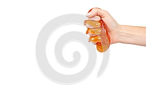 kid playing orange slime with hand, transparent toy