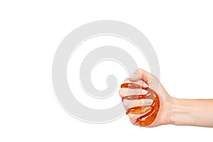 kid playing orange slime with hand, transparent toy