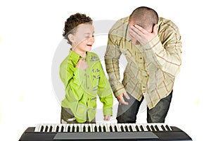 Kid playing piano badly