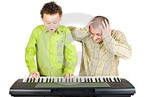 Kid playing piano badly