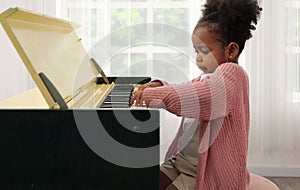 Kid playing piano, Daughter in piano class, Happy kid playing piano