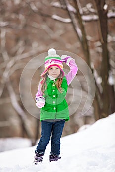 Kid playing snowballs