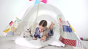 Kid playing tablet in playroom, child writing homework for school, teenager girl studying playground, children education