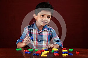 A kid playing with toy alphabets