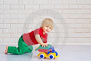 Kid playing with a toy car