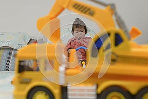 Kid playing toy, excavator prospect