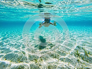 Kid playing underwater