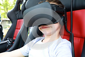 Kid playing virtual reality simulator