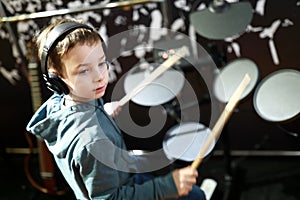 Kid plays the drums