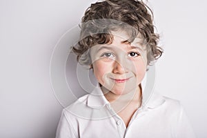 Kid portrait with curly hair on studio