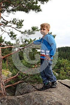 Kid posing On Mount Paaso in Karelia