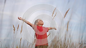 kid pray. pulls hands against a sky. child girl concept faith religion and happy family. kid girl pray hands to the side