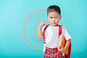 Kid from preschool kindergarten with book and school bag