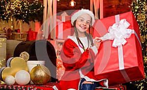 Kid with present box. winter shopping sale. magic gift box. Happy little smiling girl with christmas gift box. xmas mood