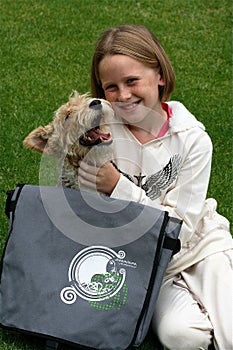 Kid and puppy playing with dreamstime bag photo