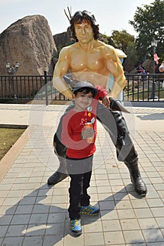 Kid with Rambo statue at Ramoji film city, hyderabad