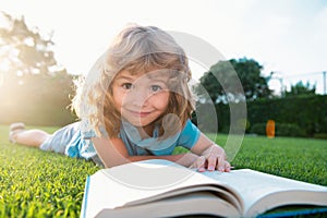 Kid read book. Child school and outdoor education. Nature and park. Early learning. Summer outdoor.