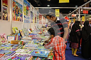 Kid reading at 8th KIBF