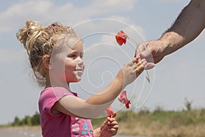 Kid receiving flowers