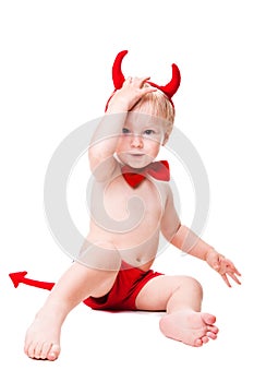 Kid in red suit of tempting devil photo